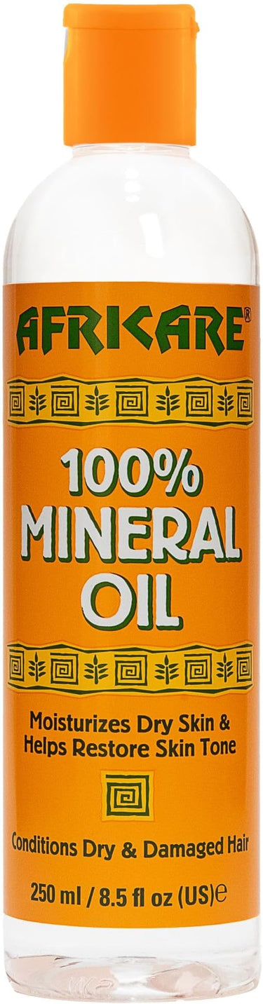 AFRICARE 100% Mineral Oil bottle with orange cap and label